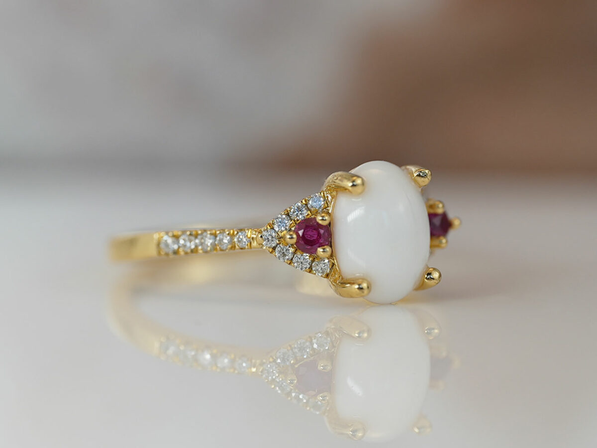 breastmilk jewelry fine ring with birth month color gems and oval breastmilk stone KeepsakeMom gold red ruby