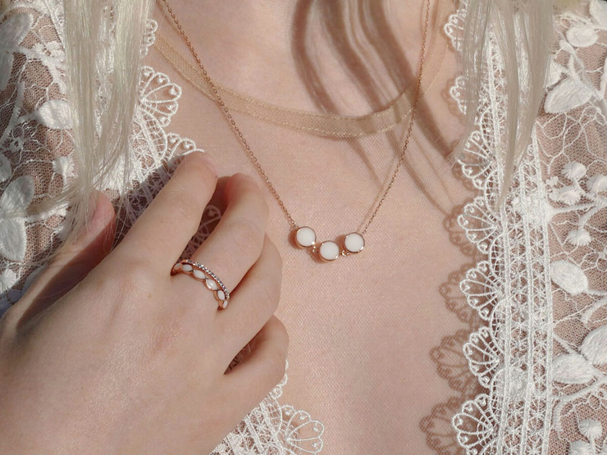 breastmilk jewelry necklace and ring model in white dress from KeepsakeMom