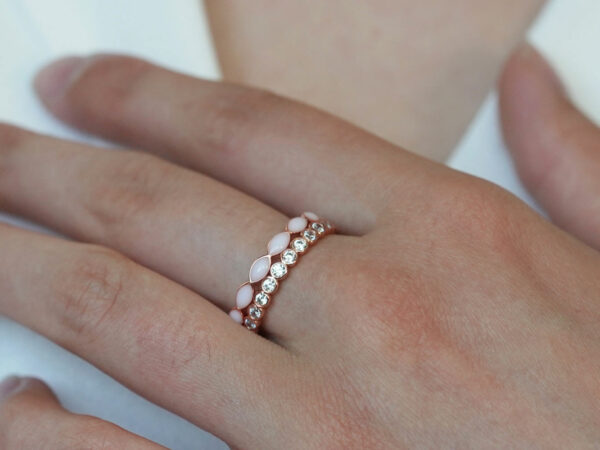 breast milk two rings set fine bands rose gold plated from keepsakemom on a model hand