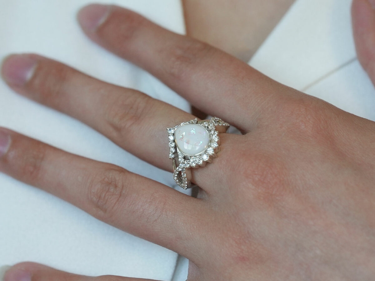 breastmilk jewelry ring crystals teardrop birth month color crystals teardrop from KeepsakeMom sterling silver white gold clear crystals model hand