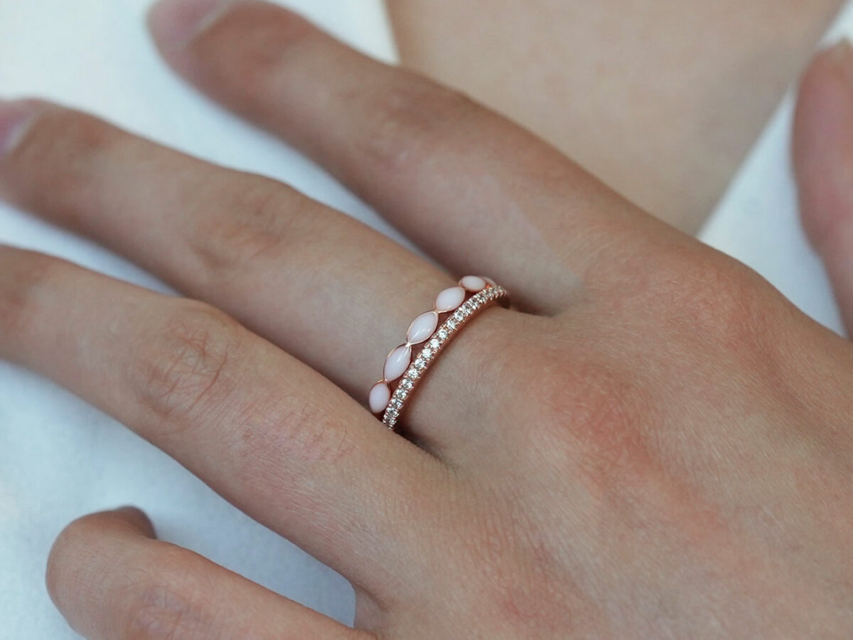 breast milk two rings set fine bands rose gold plated from keepsakemom on a model hand