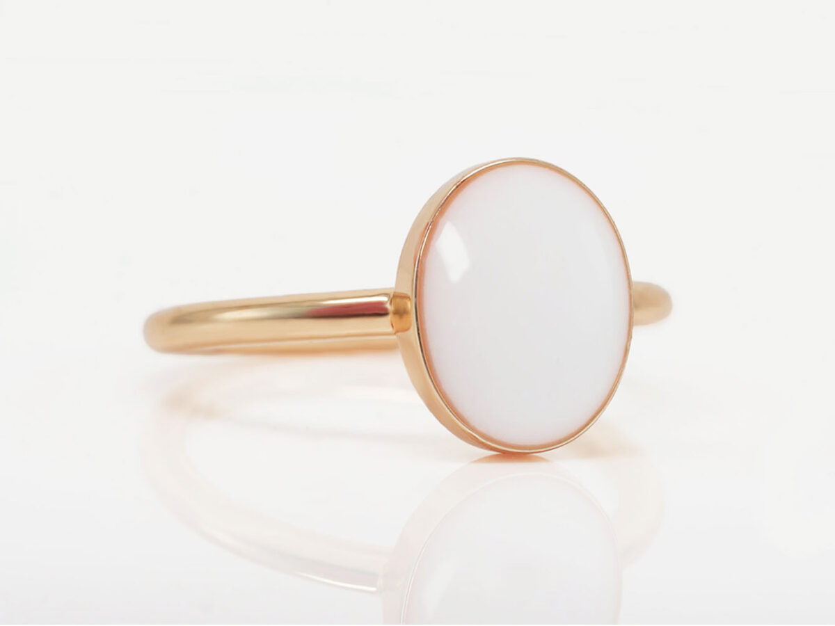 breast milk ring simple rose gold with oval breastmilk stone on white background side view from keepsakemom for DIY kit