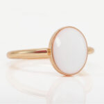 breast milk ring simple rose gold with oval breastmilk stone on white background side view from keepsakemom for DIY kit