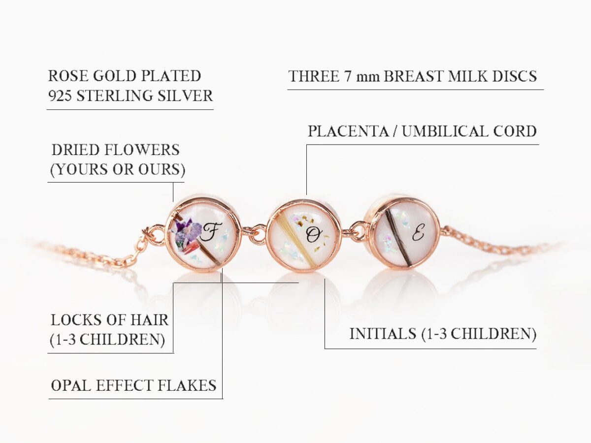 breast milk jewelry bracelet on a white background with initials, locks of hair and opal flakes and placenta specks on three tiny discs from KeepsakeMom made with rose gold