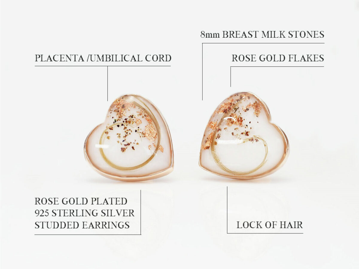 breast milk rose gold earrings heart shaped with locks of hair rose gold flakes and placenta on white background from keepsakemom