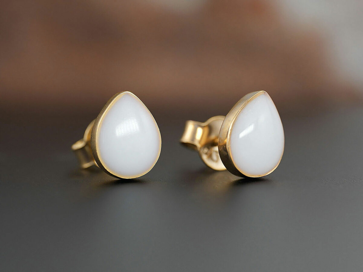 breastmilk pear teardrop shaped studded earrings from KeepsakeMom gold on brown background simple