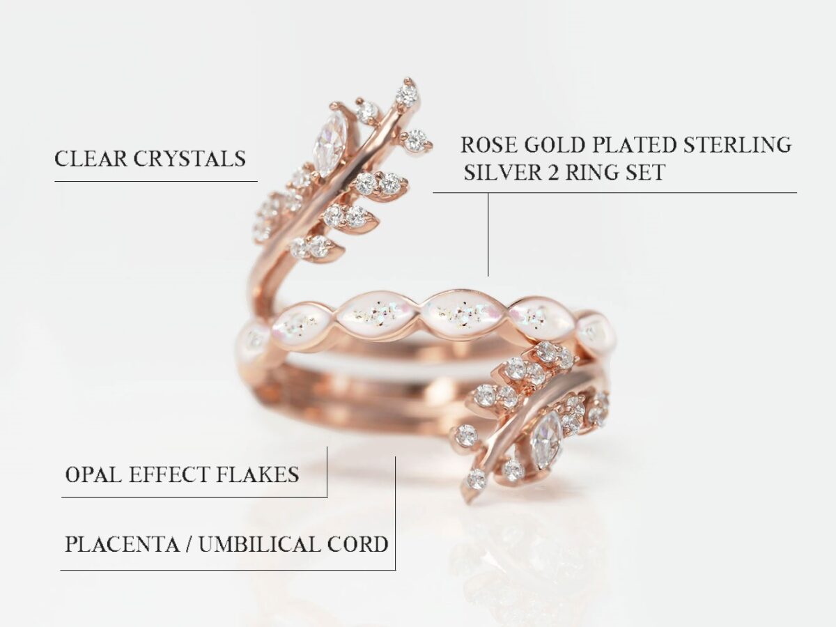 breastmilk sterling silver rose ring gold plated two ring set with top ring open branches shape with clear crystals and the middle main ring filled with breastmilk fine band marquise style leaves with breastmilk opal flakes and placenta flakes and the bottom add-on ring with clear gems diagram describing features on white background from keepsakemom