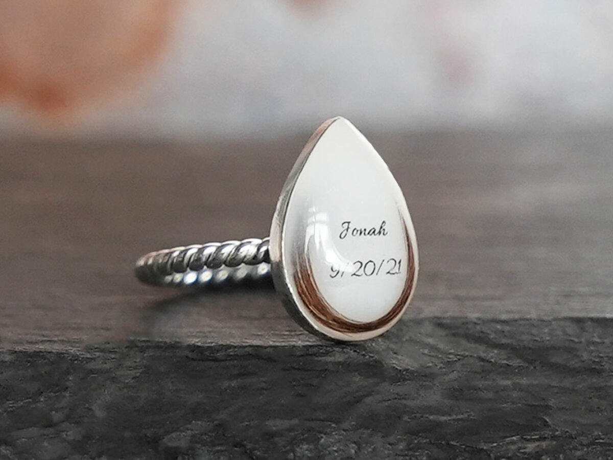 breastmilk jewelry sterling silver ring drop shaped KeepsakeMom rope band name and lock of hair, date