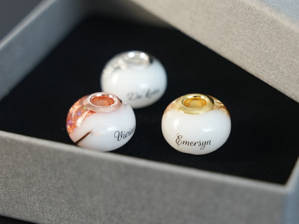 breastmilk jewelry bead with hair inclusion flakes silver yellowgold rosegold childs name birth date keepsakemom