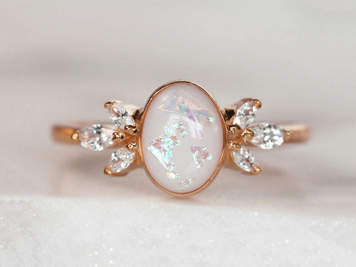 breastmilk ring burst of love oval with crystals from KeepsakeMom with opal effect flakes