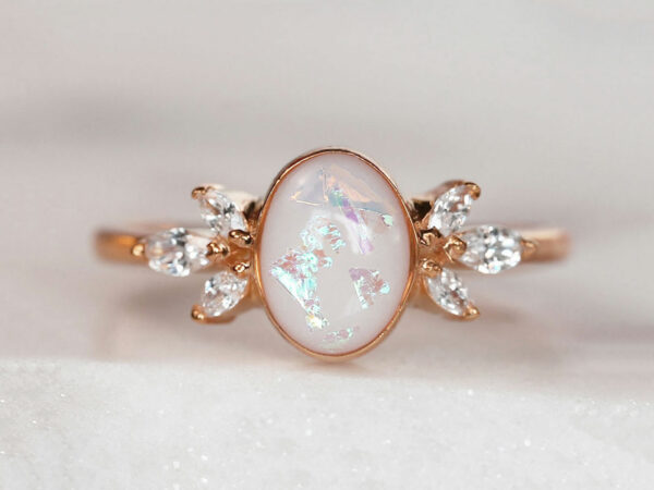 breastmilk ring burst of love oval with crystals from KeepsakeMom with opal effect flakes