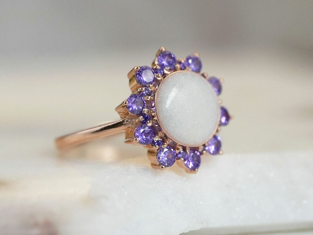 rose gold plated sterling silver sunflower-looking ring with February/June crystals with round-shaped breast milk stone with pearl powder from KeepsakeMom