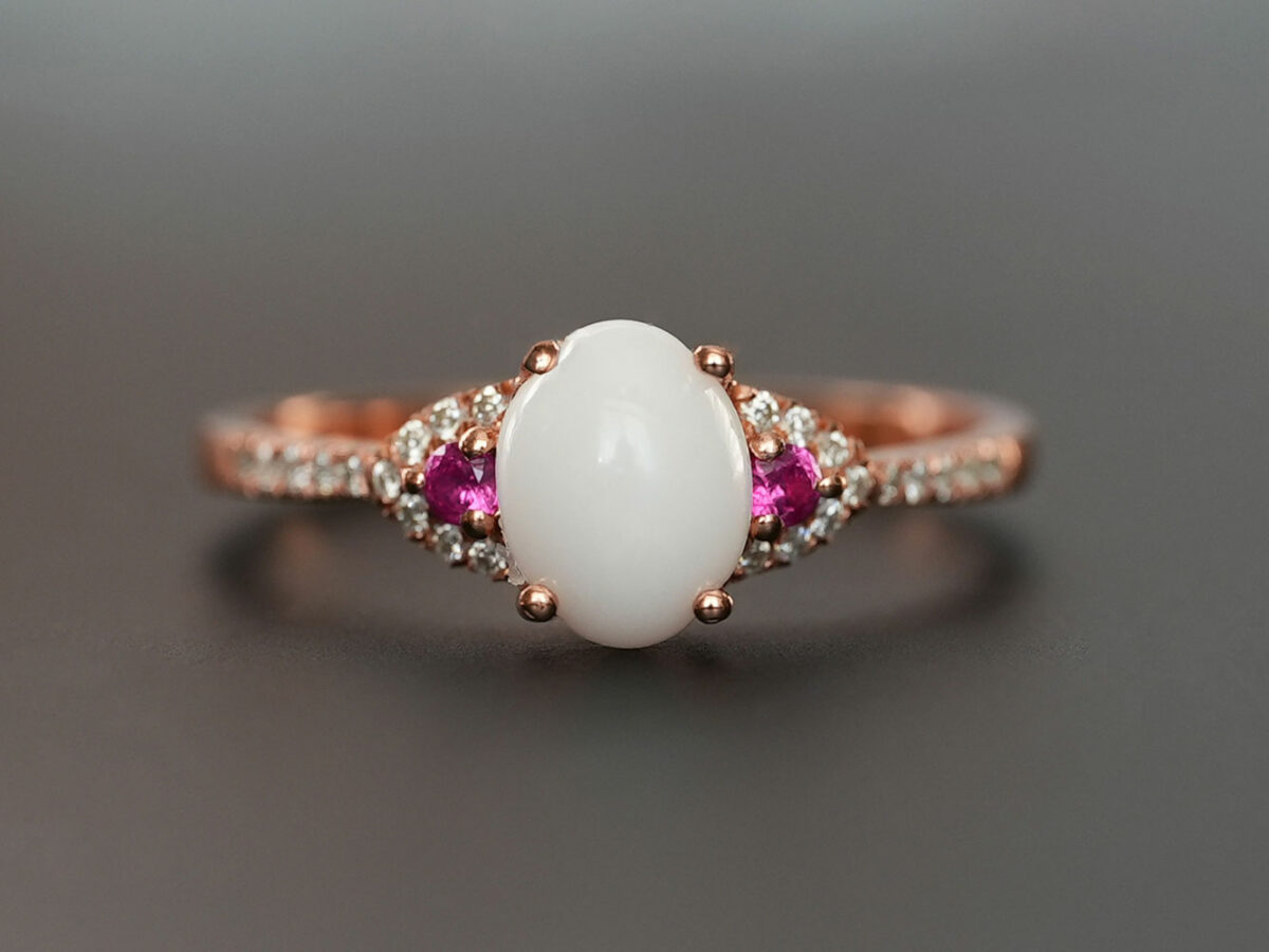 breastmilk jewelry fine ring with birth month color gems and oval breastmilk stone KeepsakeMom rose gold red ruby