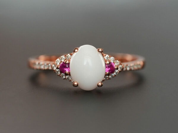 breastmilk jewelry fine ring with birth month color gems and oval breastmilk stone KeepsakeMom rose gold red ruby