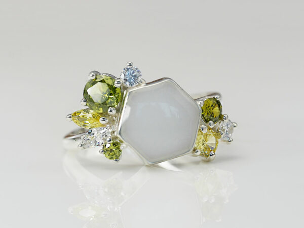 breastmilk ring in hexagon shape milk and honey with different birth month color crystals on each side from keepsakemom