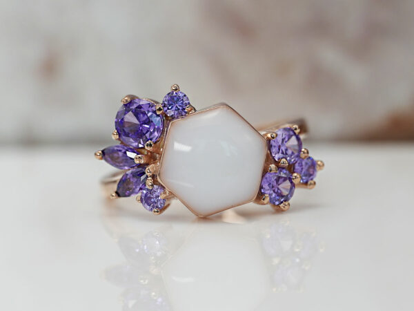 breastmilk ring in hexagon shape milk and honey with purple birth month color crystals on each side from keepsakemom