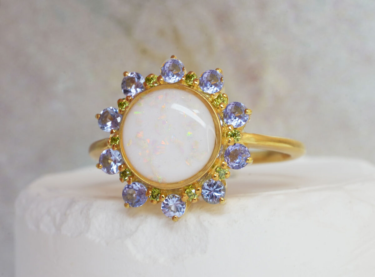 breastmilk ring flower shape with large center breastmilk round stone crystals halo with birth month color gems from keepsakemom yellow gold purple