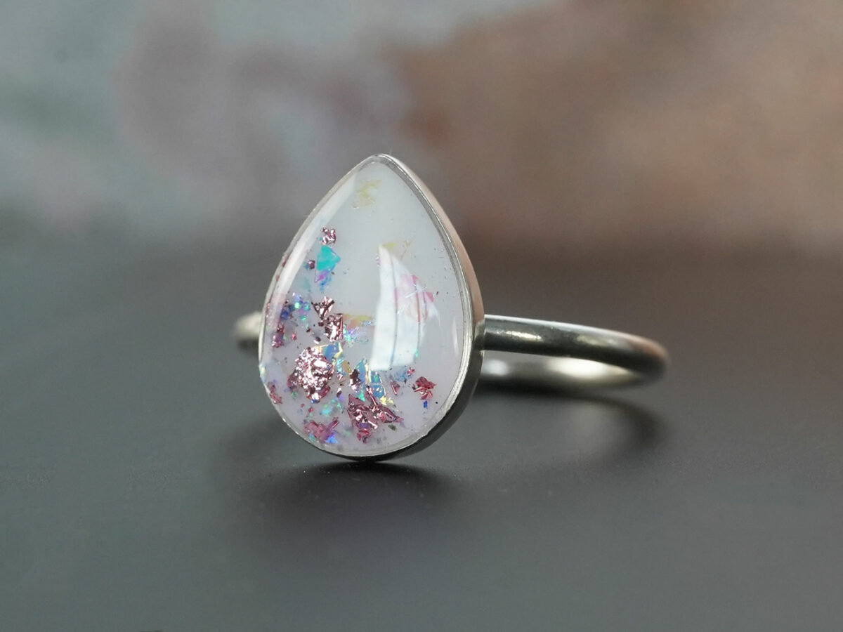 breastmilk jewelry sterling silver ring drop shaped KeepsakeMom rose pink and opal blue flakes