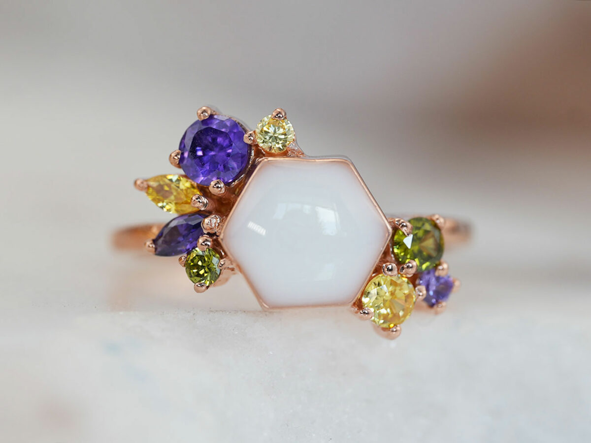breastmilk ring in hexagon shape milk and honey with different birth month color crystals on each side from keepsakemom
