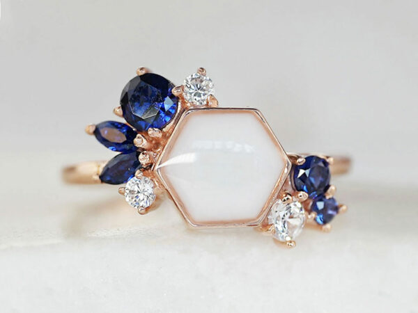 breastmilk ring in hexagon shape milk and honey with different birth month color crystals on each side from keepsakemom