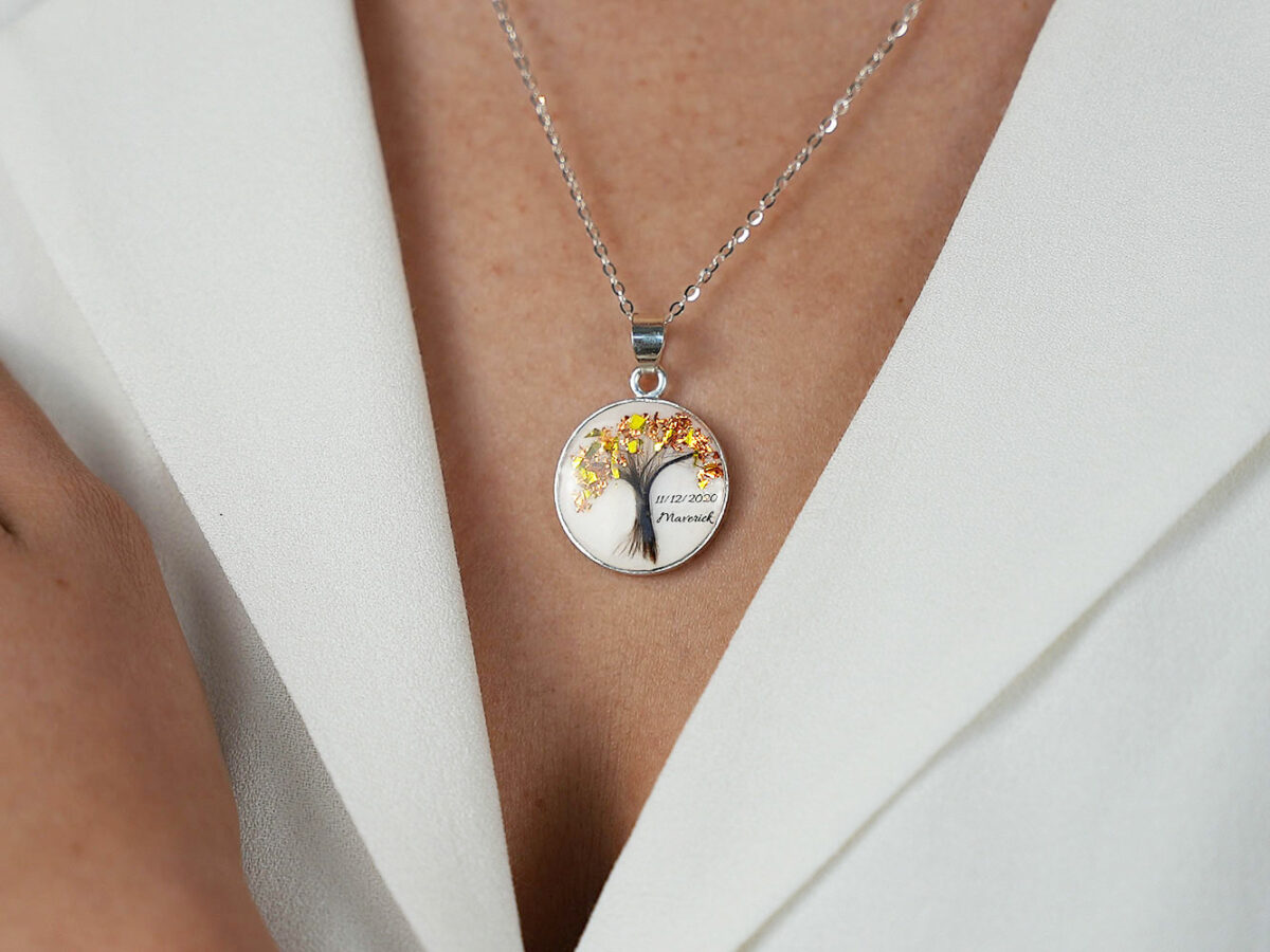 breastmilk jewelry disc necklace tree of life with baby's lock of hair and birth month color flakes tree KeepsakeMom modeled