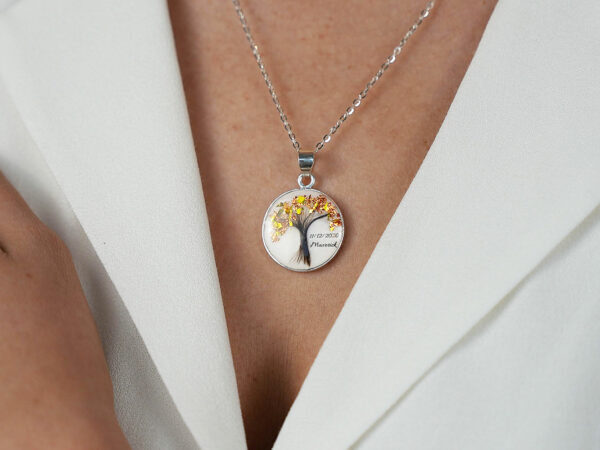 breastmilk jewelry disc necklace tree of life with baby's lock of hair and birth month color flakes tree KeepsakeMom modeled