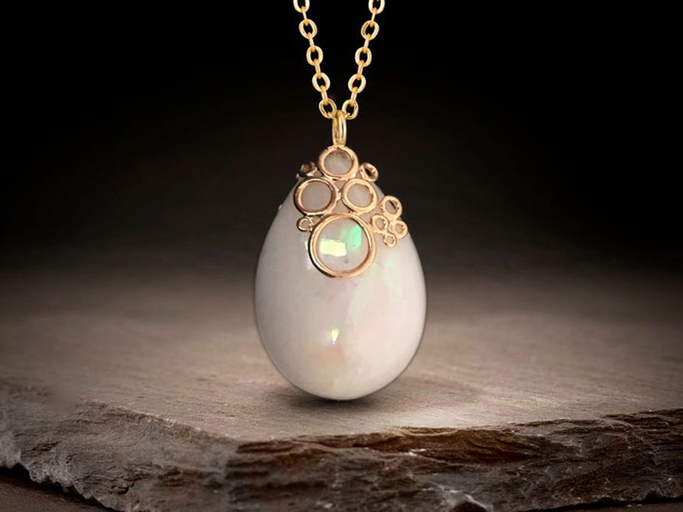 Breastmilk jewelry necklace pendant drop teardrop shape with opal effect flakes and fancy bail from KeepsakeMom yellow gold