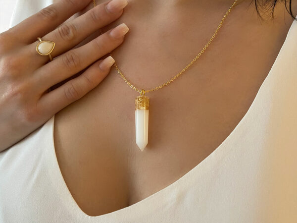 Breastmilk Jewelry dagger crystal necklace with gold flakes model from KeepsakeMom