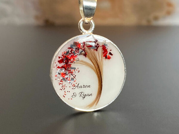 breastmilk jewelry disc necklace tree of life with baby's lock of hair and birth month color flakes tree KeepsakeMom red January and sterling silver