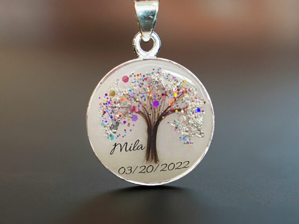 breastmilk jewelry disc necklace tree of life with baby's lock of hair and birth month color flakes tree KeepsakeMom rainbow and silver flakes