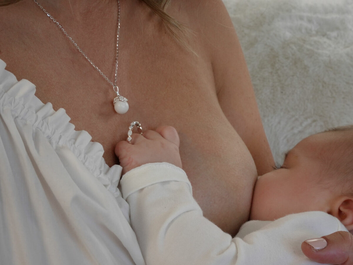 breastmilk jewelry ring and pearl necklace model mother baby from KreepsakeMom