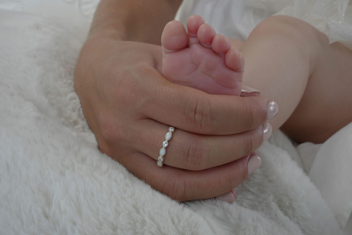 breastmilk jewelry fine band infinity ring model mother baby's foot from KreepsakeMom