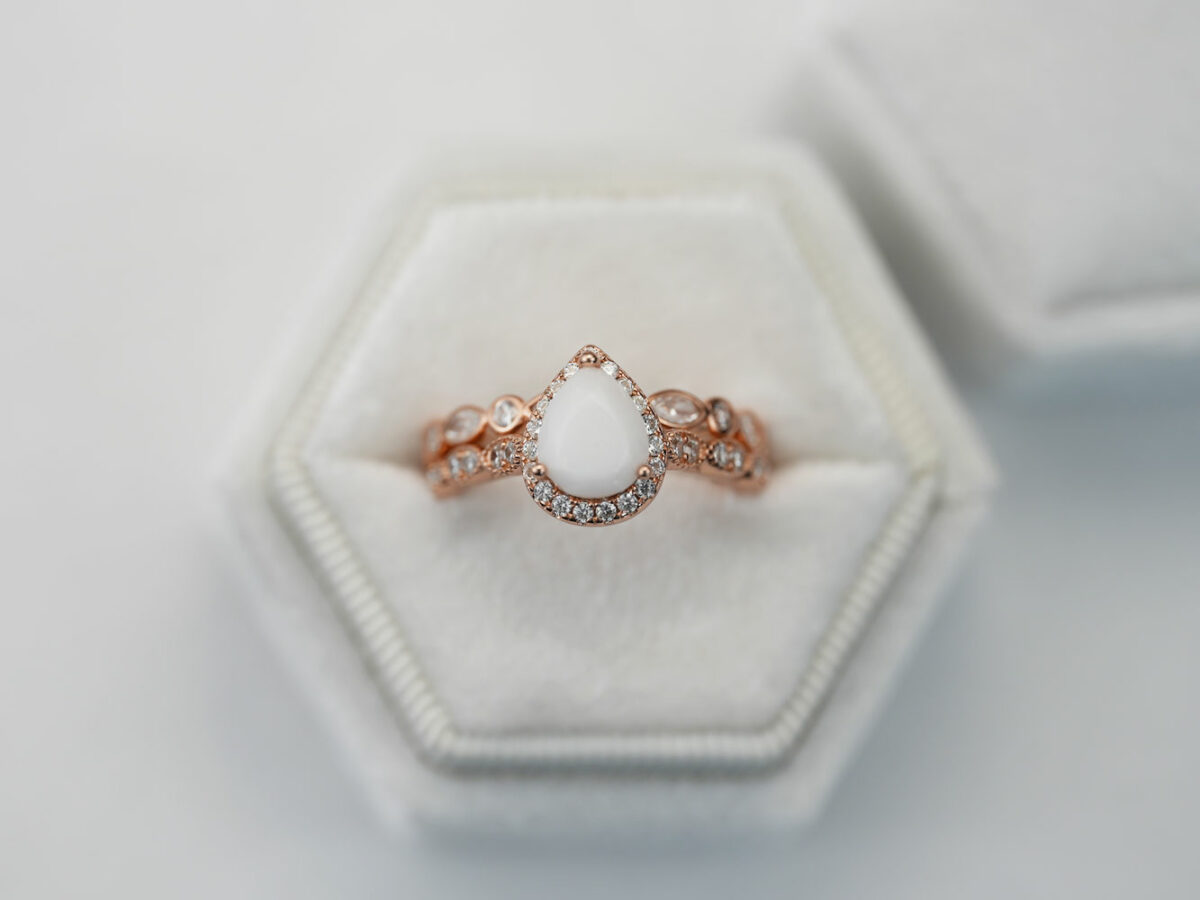 breastmilk jewelry ring set in rose gold setting pear shaped milk stone crystals two rows Keepsakemom boxed
