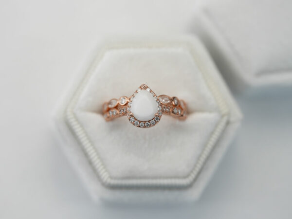 breastmilk jewelry ring set in rose gold setting pear shaped milk stone crystals two rows Keepsakemom boxed