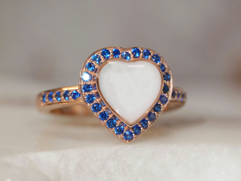 breastmilk jewelry ring with blue Sapphire September birth month color crystals around heart shaped breastmilk stone from KeepsakeMom