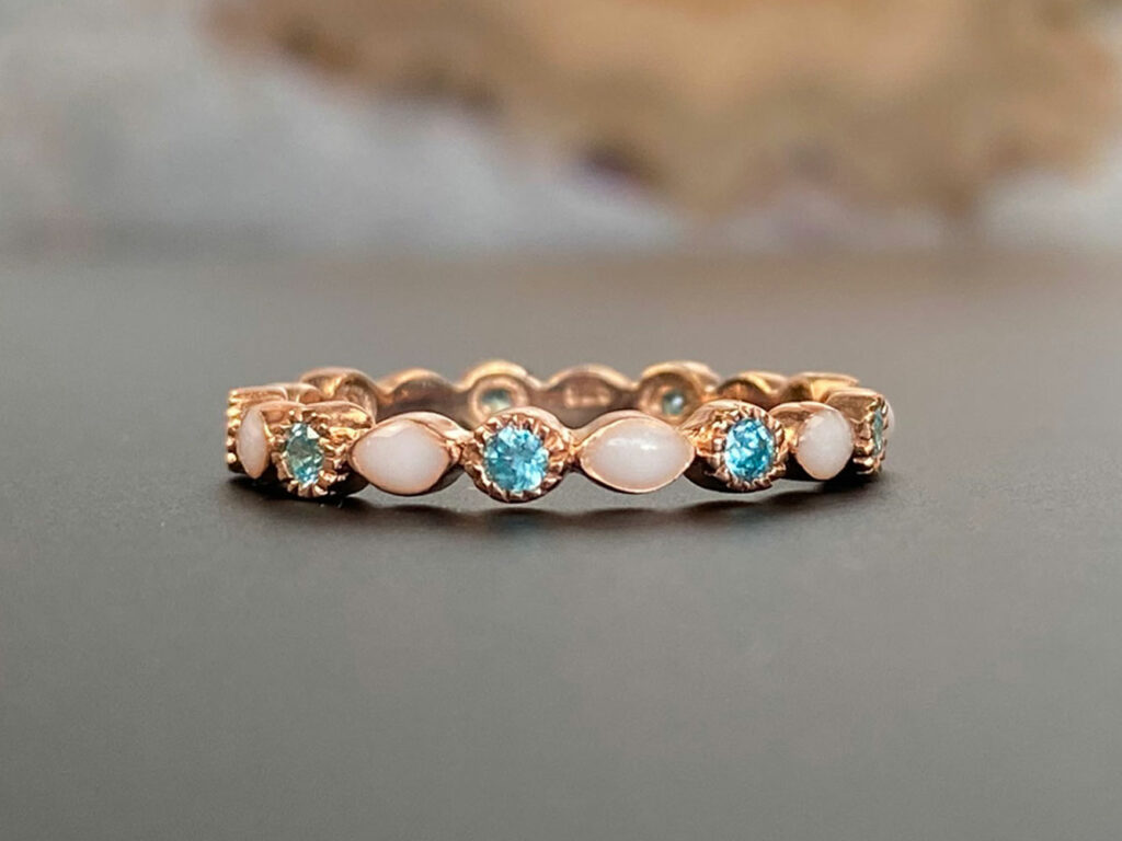 breastmilk ring fine band with aquamarine March light blue crystals from KeepsakeMom