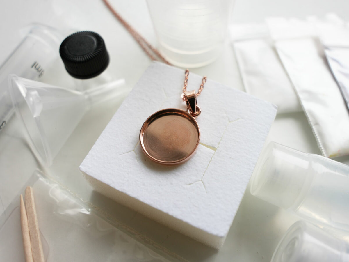 DIY Breastmilk jewelry kit from KeepsakeMom disc necklace to the moon and back rose gold set-up