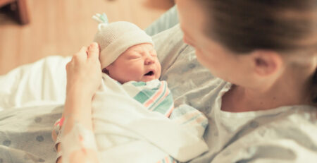 Mother in hospital holding newborn baby
