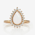 rose gold breast milk ring drop shaped with clear crystals around from keepsakemom