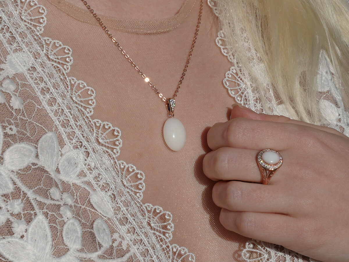 breastmilk jewelry necklace model in white dress from KeepsakeMom