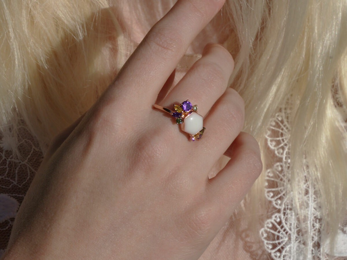 breastmilk jewelry ring model in white dress from KeepsakeMom