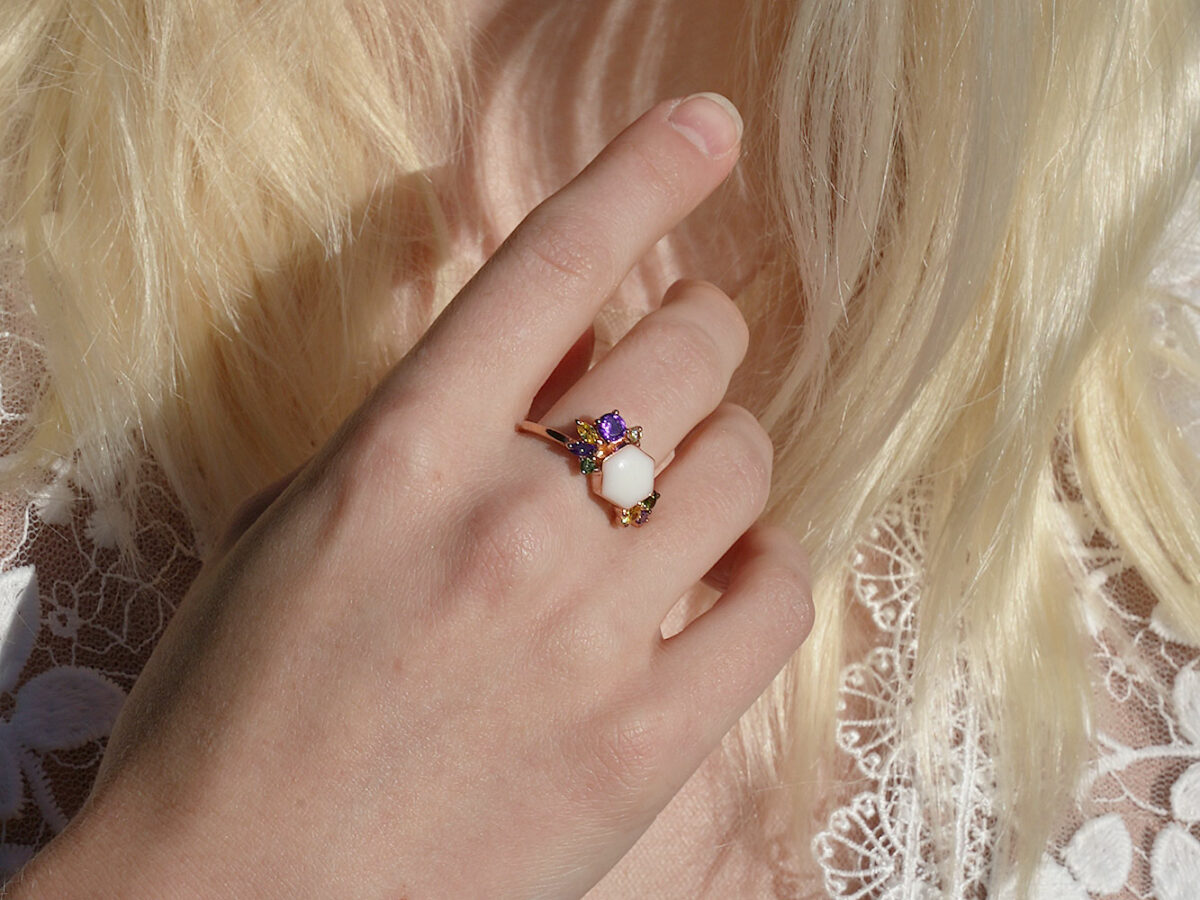breastmilk jewelry ring hexagon honeycomb birth month colored crystals and gems from KeepsakeMom model hand