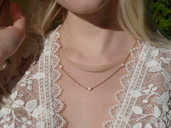 breastmilk jewelry necklace model in white dress from KeepsakeMom