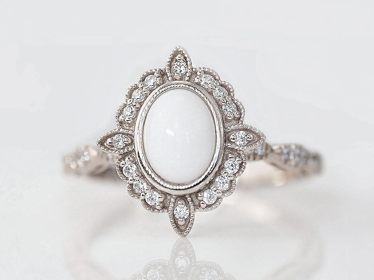 breast milk ring in art deco style with oval milk central stone in sterling silver setting from keepsakemom