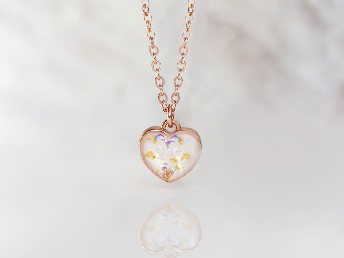 Breastmilk Jewelry Necklace Simple Shape Keepsakemom (2) breastmilk jewelry fine and tiny, dainty necklace with 6mm heart filled with milk and gold and purple flakes from KeepsakeMom in rose gold