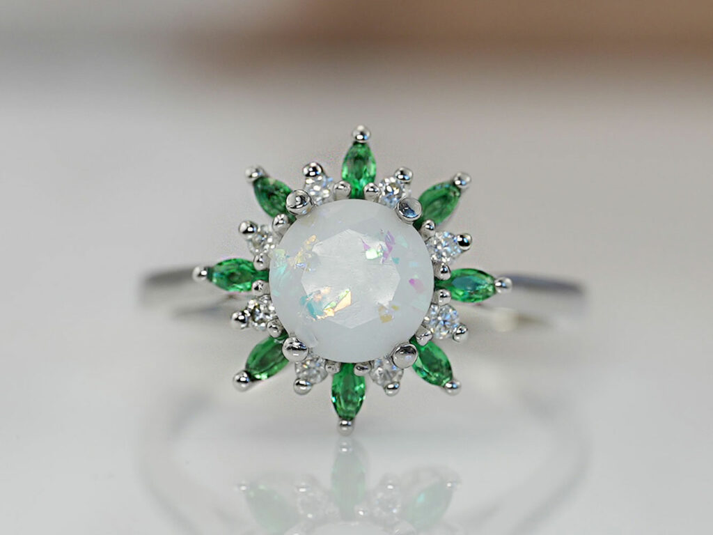 breastmilk jewelry rose gold heart shaped ring with may emerald birth month color crystals gems around breastmilk central stone from keepsakemom