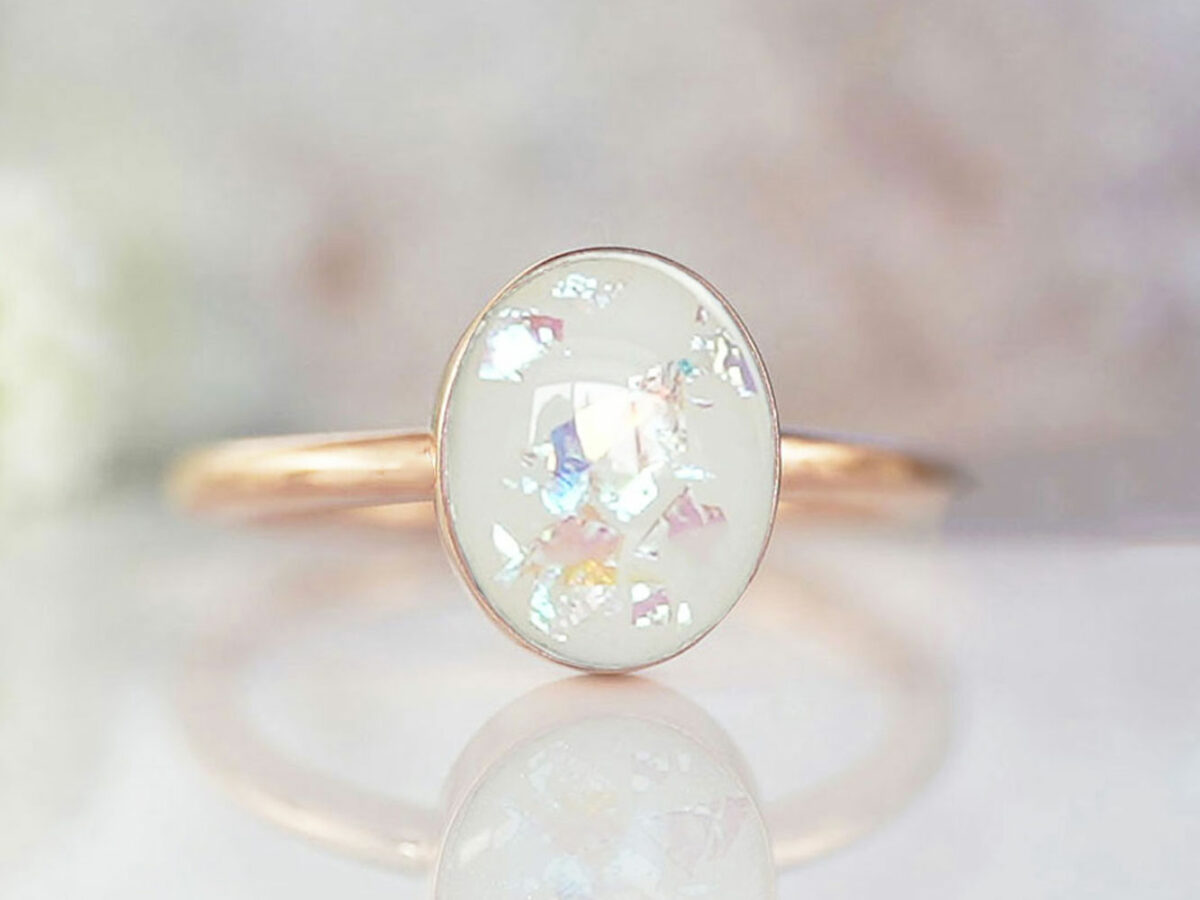 breast milk ring simple rose gold with oval breastmilk stone with opal flakes on light background from keepsakemom for DIY kit