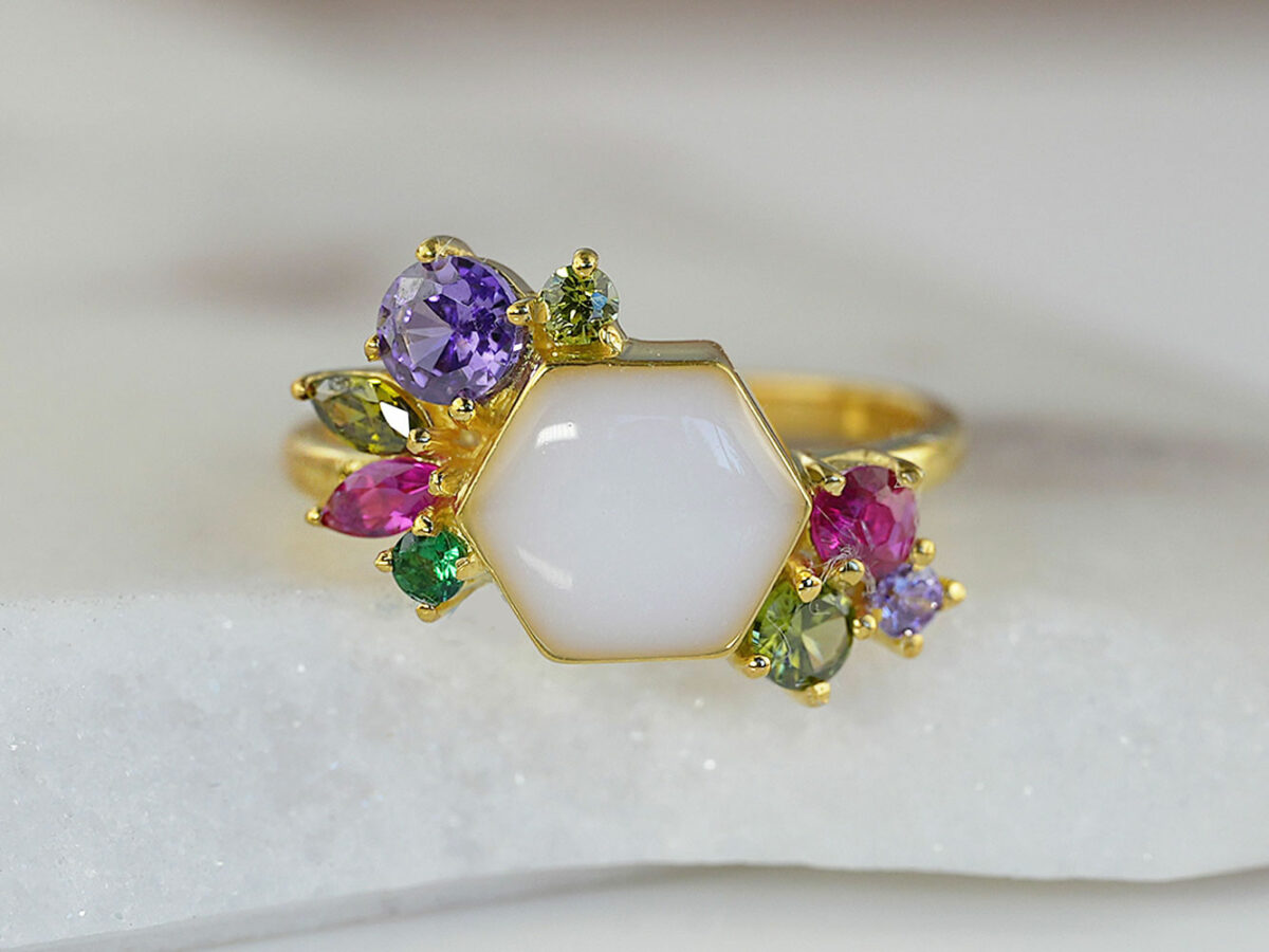 breastmilk ring in hexagon shape milk and honey with different birth month color crystals on each side in yellow gold from keepsakemom