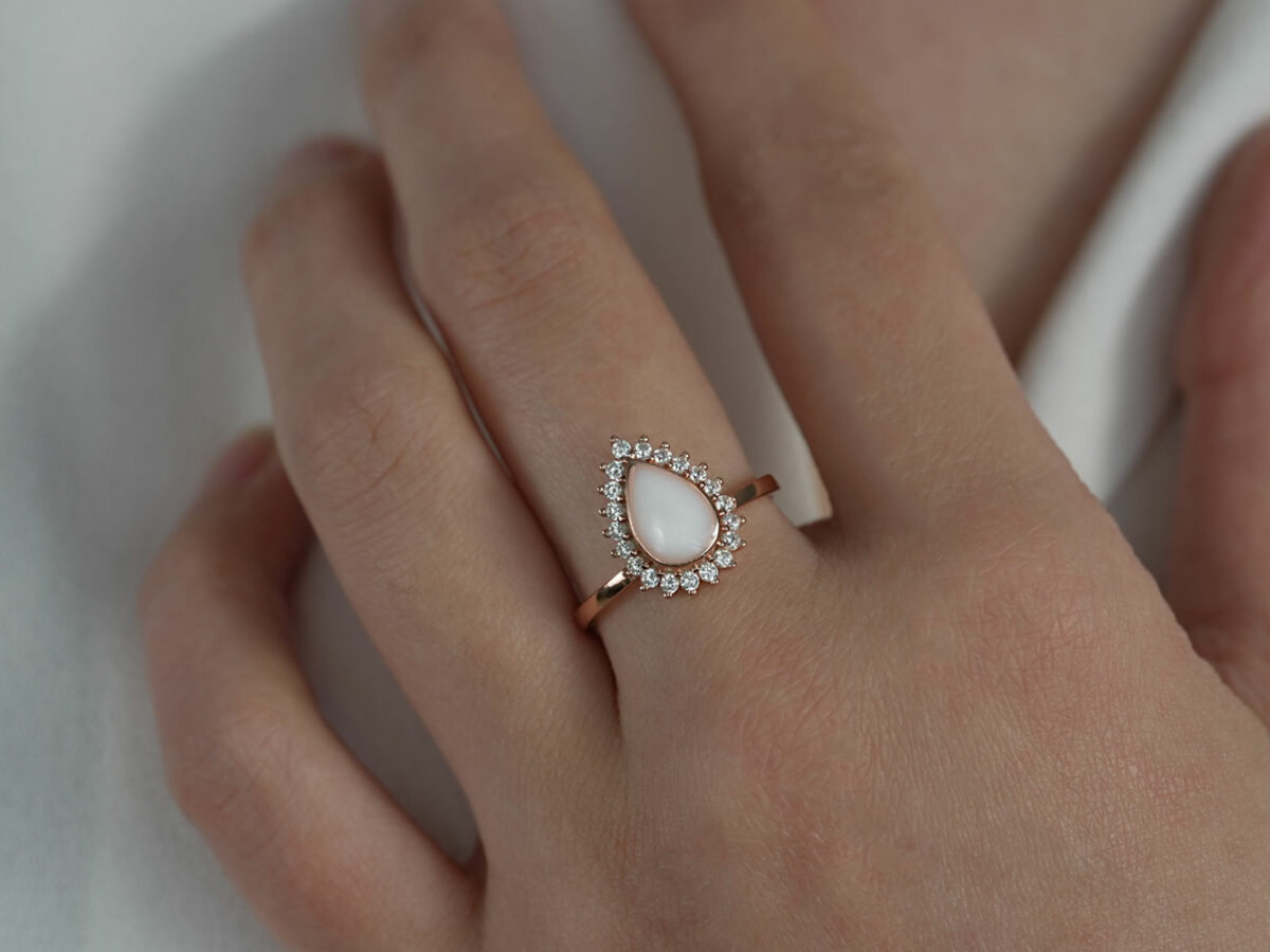 breastmilk jewelry ring teardrop with crystals rose gold sterling silver KeepsakeMom on model hand