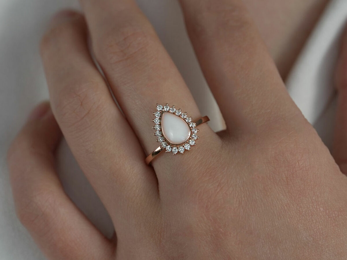 breastmilk jewelry ring teardrop with crystals rose gold sterling silver KeepsakeMom model hand